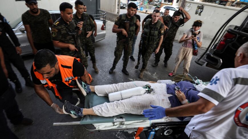 Medics rush Aysenur Ezgi Eygi into the emergency ward of a hospital in Nablus