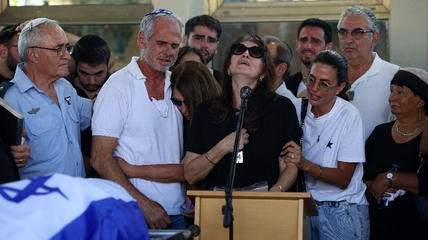 Nira, the mother of Almog Sarusi, an Israeli hostage killed in Gaza, during the funeral of her son in Raanana