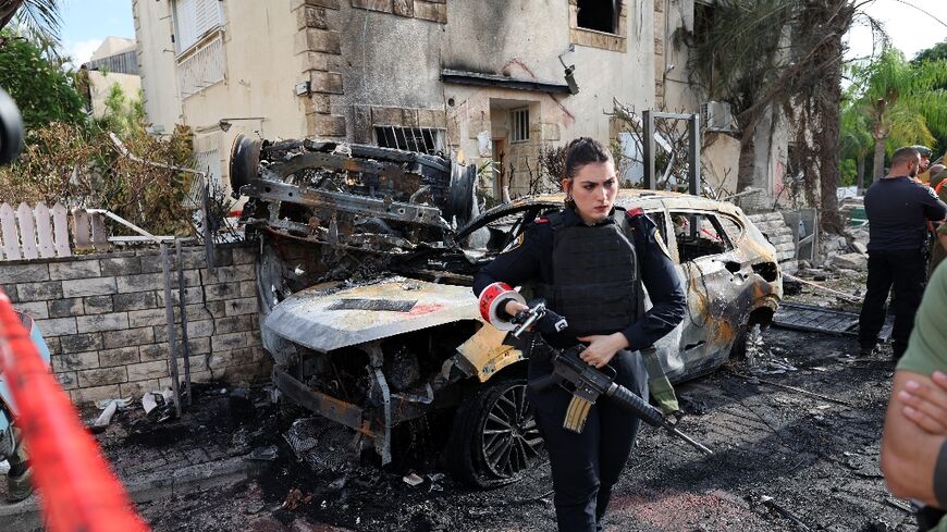 A member of the Israeli security forces in Kiryat Bialik, near the city of Haifa, after a Hezbollah rocket strike from Lebanon