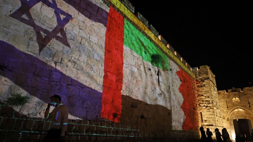 The flags of Israel, United Arab Emirates, and Bahrain are projected on the ramparts of Jerusalem's Old City on September 15, 2020 in a show of support for Israeli normalisation deals with the United Arab Emirates and Bahrain. - Israeli Prime Minister Benjamin Netanyahu signed landmark accords normalizing the Jewish state's relations with the United Arab Emirates and Bahrain, as part of a peace push brokered by US President Donald Trump. (Photo by Menahem KAHANA / AFP) (Photo by MENAHEM KAHANA/AFP via Getty