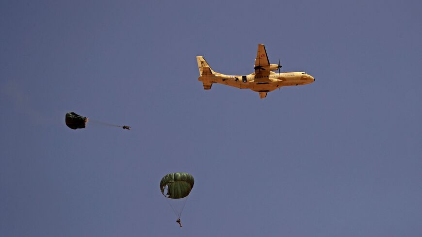 Paratroopers jump off an Egyptian C-130 Hercules military plane during the "Guardians of the Nile" joint military drill between Egypt and Sudan in the Um Sayyala area, northwest of Khartoum, on May 31, 2021.