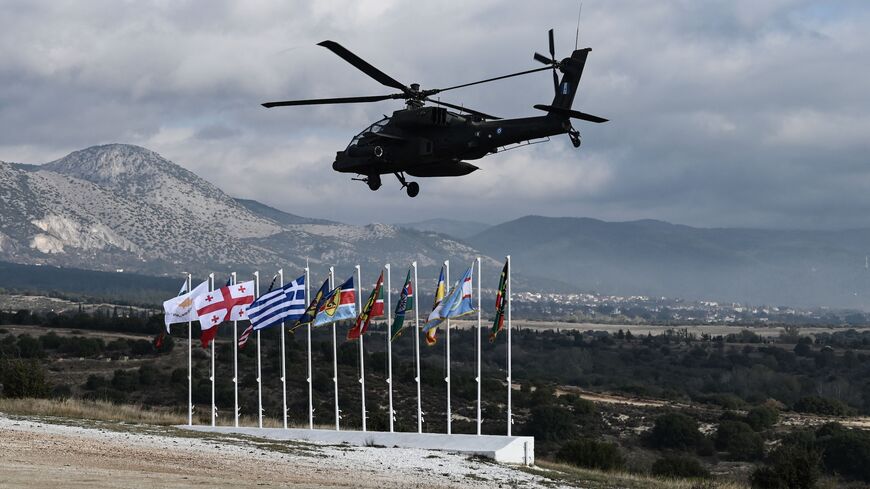 A Hellenic air force helicopter flies during the Olympic Cooperation 23 exercise at the Petrochori training area, near Xanthi, northern Greece, on Nov. 24, 2023.