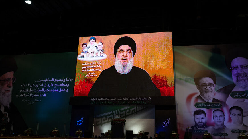 Hezbollah Secretary General Hassan Nasrallah give a televised speech in a hanger in the Beirut suburb of Dahiyeh in Lebanon on May 24, 2024, following the death of President Ebrahim Raisi of Iran in a helicopter crash. 