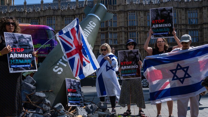 Pro-Israel demonstrators stage a counterprotest around an Oxfam installation.