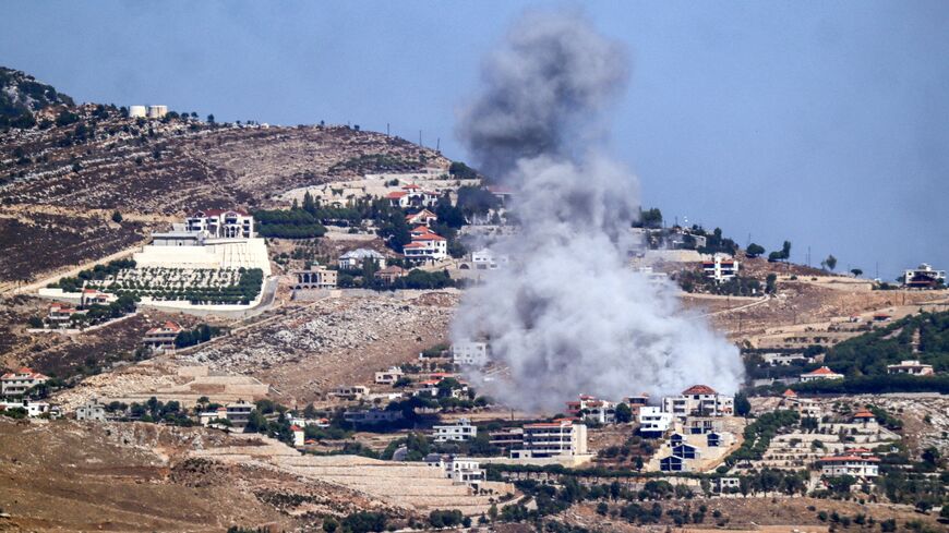 A cloud of smoke erupts during an Israeli airstrike on the village of Sujud in southern Lebanon on Sept. 25, 2024.