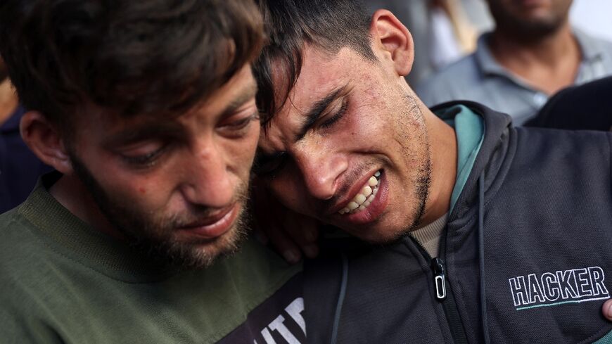 Ali Assaf (R), 20, was reported to be the only survivor of an Israeli air strike on Jabalia that killed his family