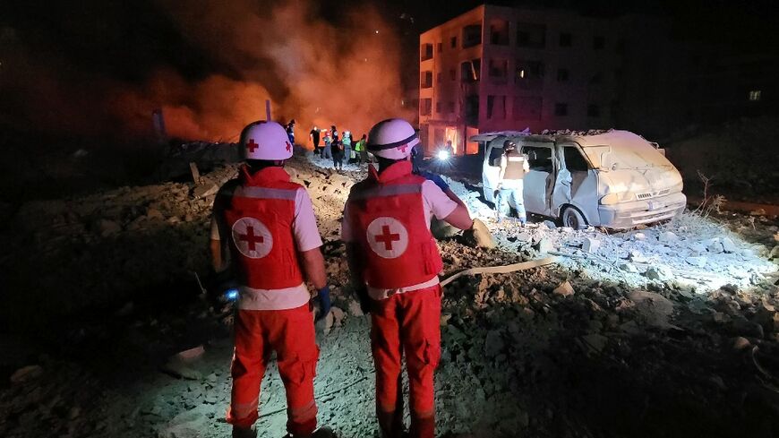 Responders arrive at the site of an Israeli airstrike that targeted the southern Lebanese village of Toul amid the ongoing war between Israel and Hezbollah.