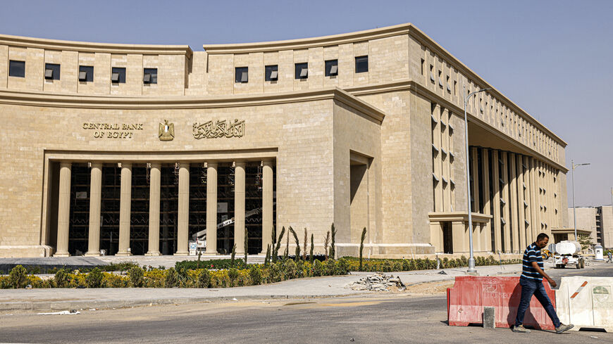 A man walks near the new headquarters of Egypt's Central Bank at the New Administrative Capital megaproject about 45 kilometres east of the current capital Cairo on Aug. 1, 2023. 