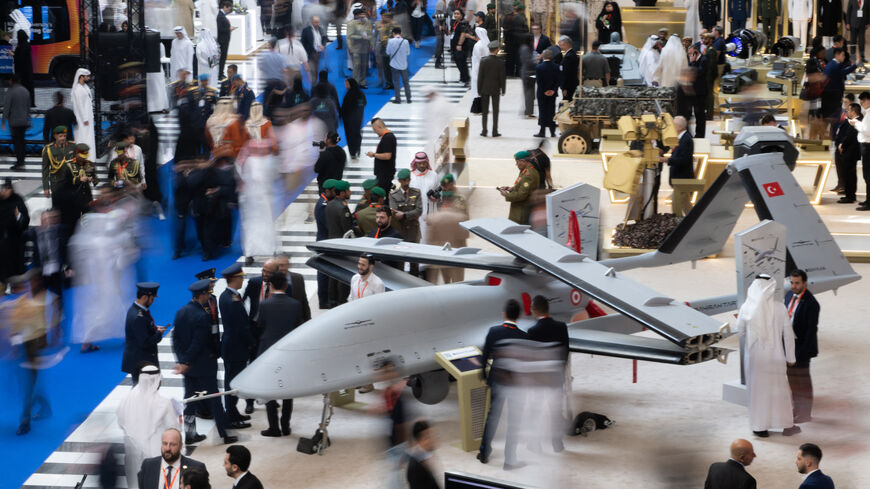 Visitors walk among displays at the UMEX Exhibition showcasing drones, robotics, and unmanned sytems at the Abu Dhabi National Exhibition Centre in Abu Dhabi on January 23, 2024. (Photo by Ryan LIM / AFP) (Photo by RYAN LIM/AFP via Getty Images)