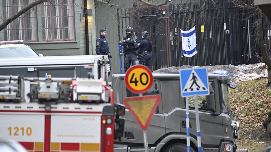 Police officers are seen outside the Israeli embassy in Stockholm, Jan. 31, 2024.