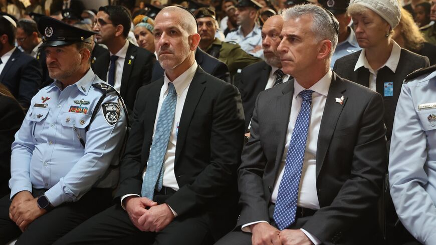 Mossad intelligence agency chief David Barnea (R) and Ronen Bar (2nd L), chief of Israel's domestic Shin Bet security agency, attend a ceremony.