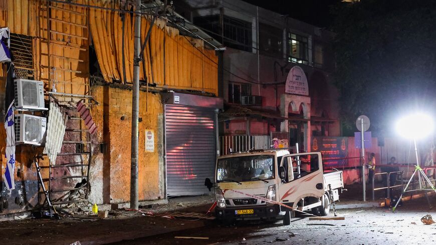 Israeli security and emergency personnel cordon off the site of an explosion in Tel Aviv, on Aug. 18, 2024.