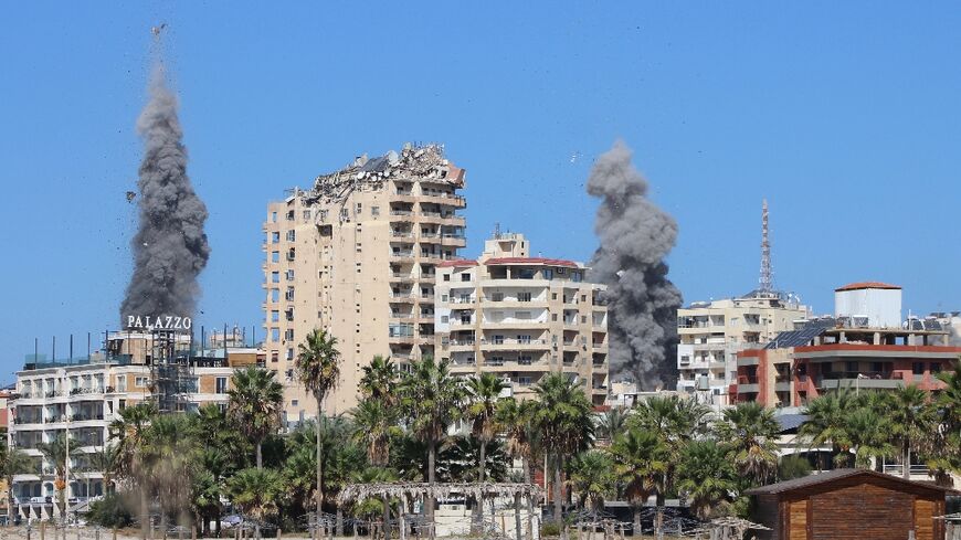 Plumes of smoke rise over the Lebanese coastal city of Tyre after Israeli air strikes