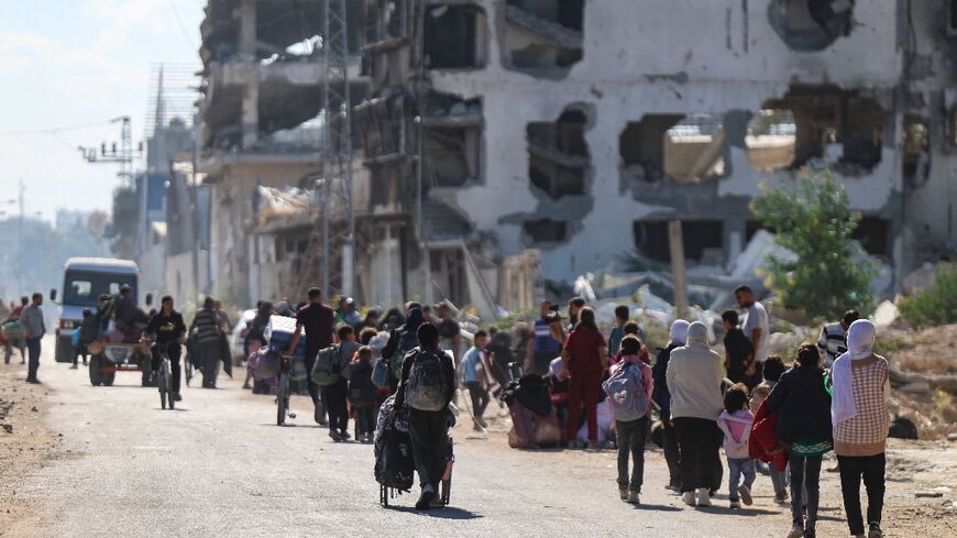 Displaced Palestinians fleeing Israeli military operations in Beit Lahia in the northern Gaza Strip