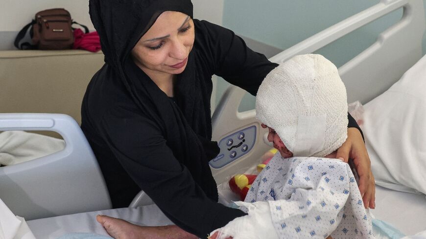 Fatima Zayoun with Ivana, who suffered third-degree burns in an Israeli strike