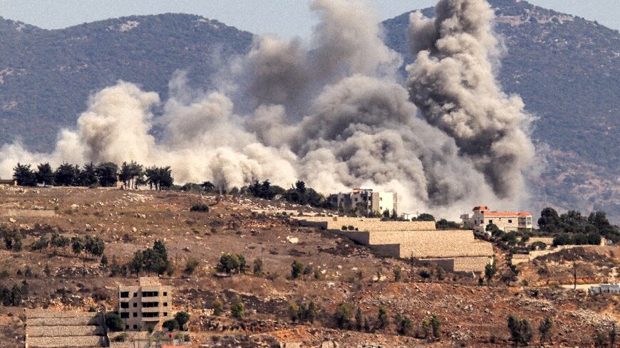 Smoke clouds erupt during an Israeli air strike on Khiam in southern Lebanon near the border with Israel on October 2, 2024