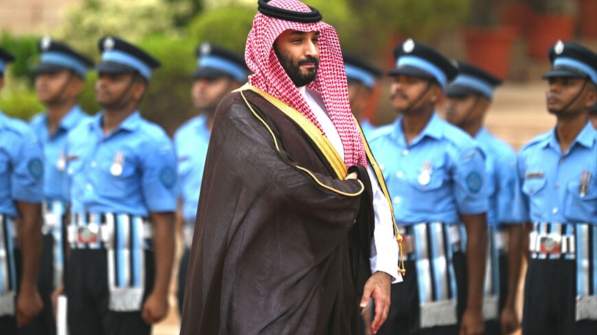 Saudi Arabia's Crown Prince and Prime Minister Mohammed bin Salman (C) inspects a guard of honour during a ceremonial reception at the President House a day after the G20 summit in New Delhi on September 11, 2023. (Photo by Money SHARMA / AFP) (Photo by MONEY SHARMA/AFP via Getty Images)