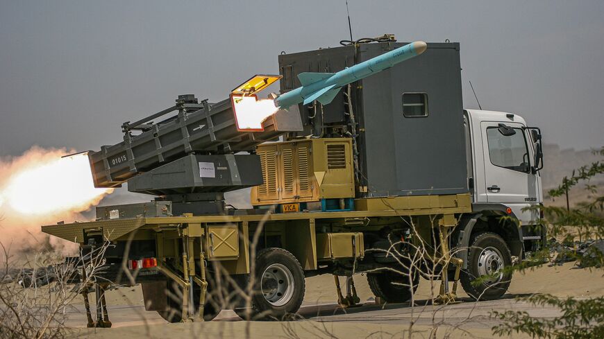 Iran's Islamic Revolutionary Guard Corps special forces fire a short-range missile during a military drill in the Gulf of Oman near Iranian southern port town of Bandar-e-Jask on Tuesday, April 4, 2006. 