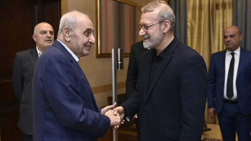 Senior adviser to Iran's supreme leader Ali Larijani (R) meets with Lebanon's Parliament Speaker Nabih Berri (L) in Beirut on Nov. 15, 2024, amid the ongoing war between Israel and Hezbollah. 