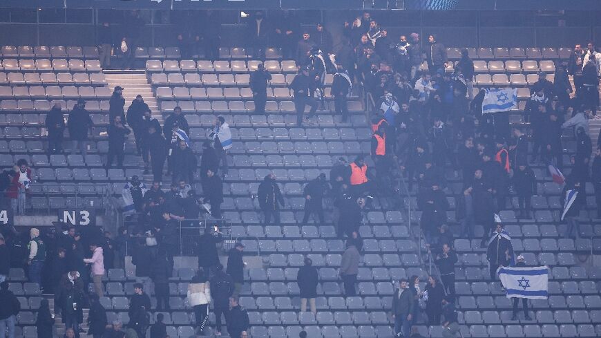 Stadium security staff intervene to stop Israel and France supporters from clashing at the Stade de France