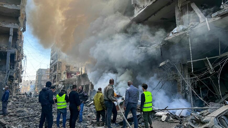 Firefighters douse a blaze after an Israeli air strike in the Ghobeiry neighbourhood of Beirut’s southern suburbs