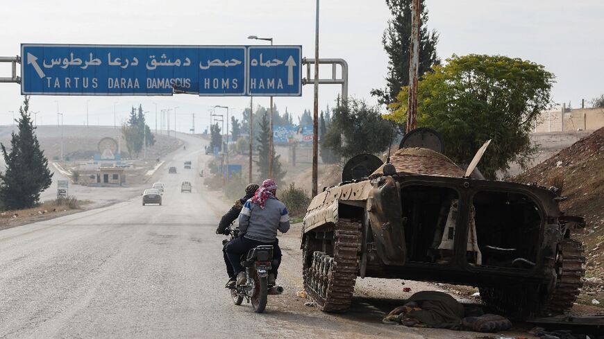 A Syrian government military vehicle lies abandoned in Hama governorate