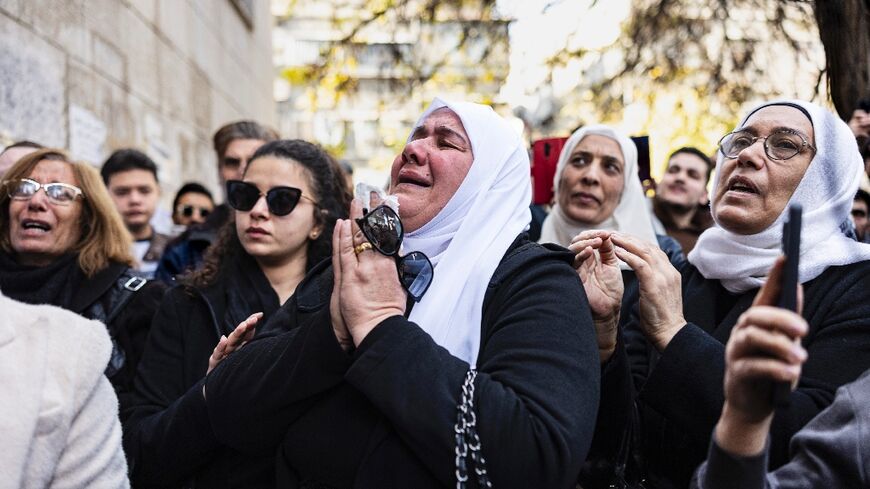 Mourners at the funeral of Syrian activist Mazen al-Hamada in Damascus