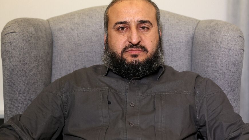 Murhaf Abu Qasra, a former agronomist, has led the armed wing of Syria's Islamist group Hayat Tahrir al-Sham