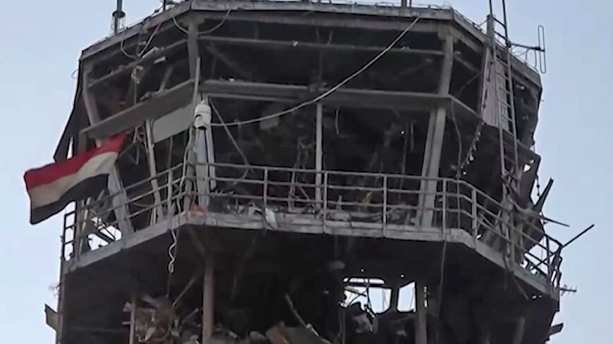 An image taken from a handout video provided by the Huthis' official Al-Masirah TV station shows the damage to the airport from an Israeli strike