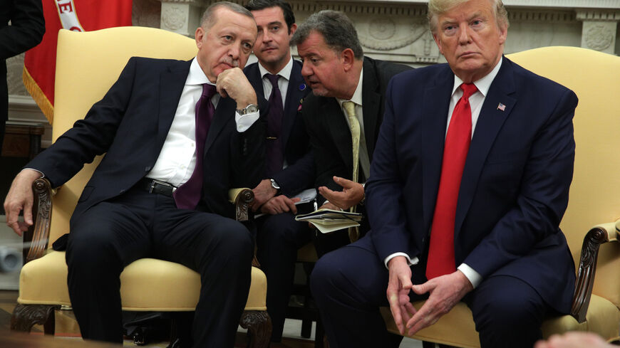 WASHINGTON, DC - NOVEMBER 13: Turkish President Recep Tayyip Erdogan listens to translation as he meets with U.S. President Donald Trump and five Republican U.S. senators in the Oval Office of the White House on November 13, 2019 in Washington, DC. During their meeting, Trump and Erdogan were scheduled to discuss Turkey's purchase of a Russian air defense system as well as the Turkish offensive against the Kurds in Syria. Also in DC today, the first public impeachment hearings took place in the House Intell