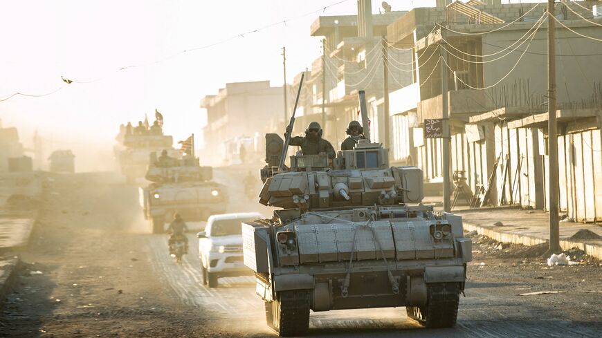 US forces patrol oil fields near Syria's northeastern border with Turkey in the Qahtaniyah countryside in the far northeast corner of Hasakah province, on Sept. 3, 2024.