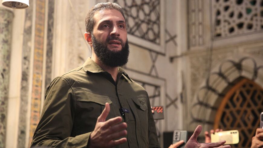 Abu Mohammed al-Jolani addresses a crowd at the capital's landmark Umayyad Mosque on Dec. 8, 2024. 