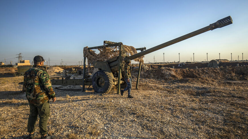 Fighters with the Kurdish-led Syrian Democratic Forces (SDF) inspect damaged and abandoned military vehicles and equipment at the Qamishli international airport, formerly a joint Syrian-russian military base, in northeastern Syria's city of Qamishli on Dec. 9, 2024.