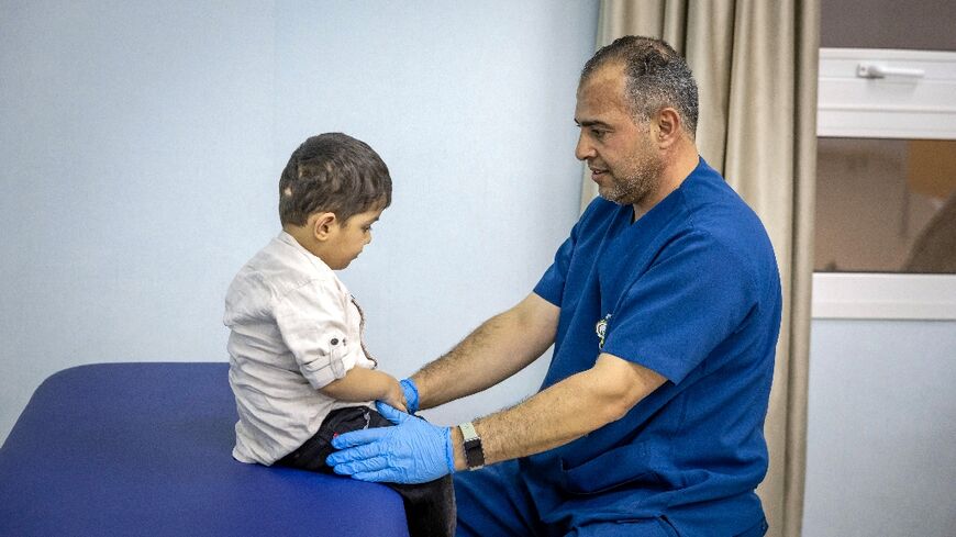 A doctor in Abu Dhabi cares for a Palestinian child injured in the Gaza Strip during the war between Israel and Hamas