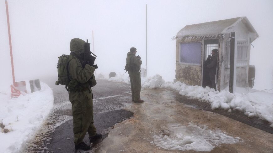 Israeli soldiers stand guard on the lower slopes of Mount Hermon in November, before the army seized the summit inside the UN-patrolled buffer zone earlier this month.