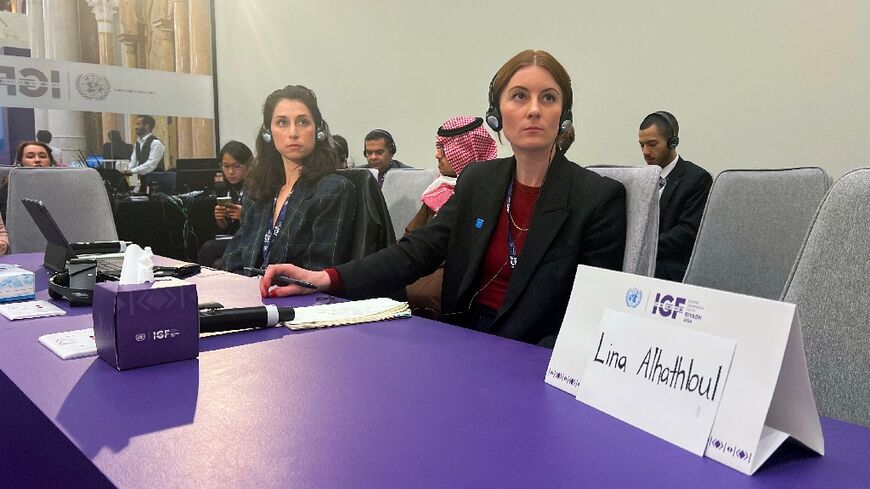 A sign stands in front an empty seat for Saudi human rights activist Lina al-Hathloul, during the Internet Governance Forum in Riyadh