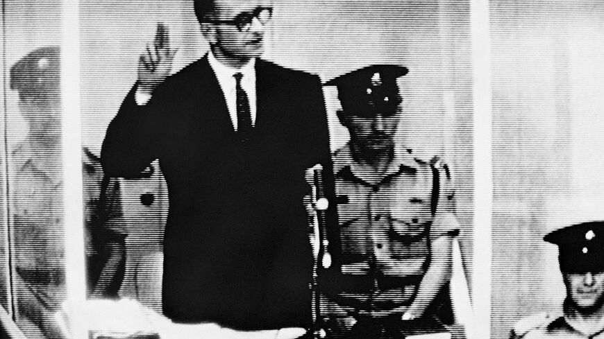 Nazi leader and war criminal Adolf Eichmann takes oath during his trial before an Israeli court in Jerusalem in 1961