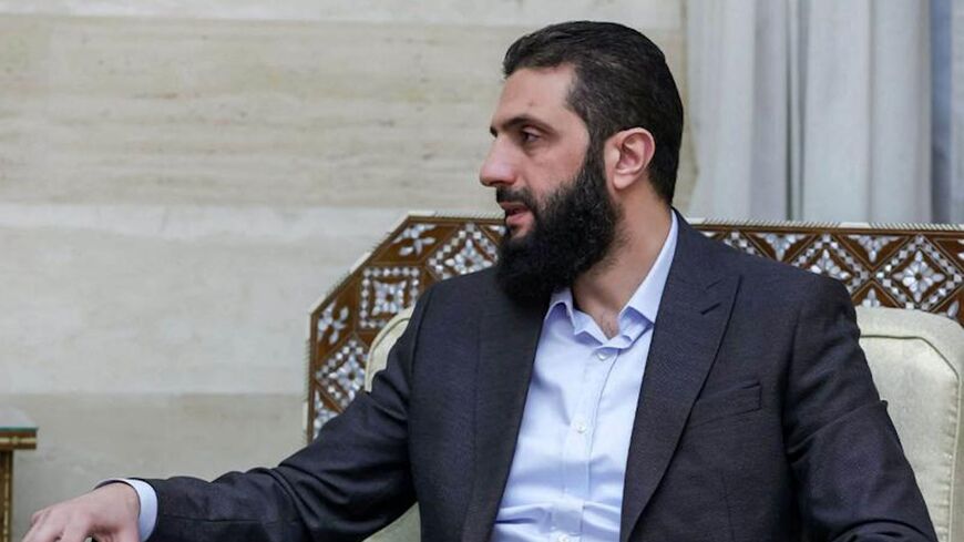 A handout showing Ahmed al-Sharaa while meeting with a UK delegation in Damascus, Dec. 17, 2024. 