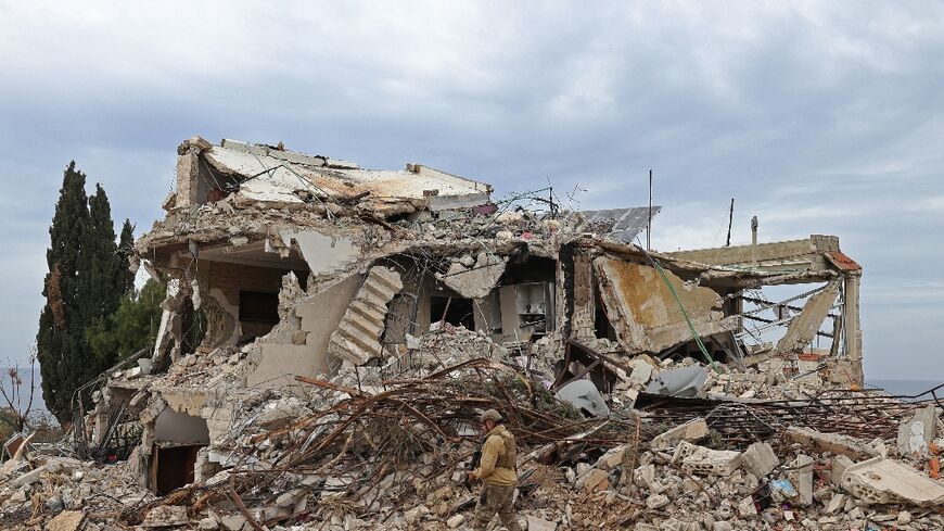 A Lebansese soldier patrols a residential area in Naqura that was devastated by the war between Israel and Hezbollah