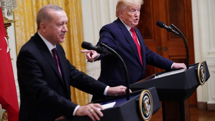 US President Donald Trump and Turkey's President Recep Tayyip Erdogan (L) take part in a joint press conference in the East Room of the White House in Washington, DC on November 13, 2019. President Donald Trump greeted his Turkish counterpart Recep Tayyip Erdogan at the White House for a high-stakes meeting Wednesday that underlined his claim to be ignoring the impeachment drama unfolding simultaneously in Congress. (Photo by MANDEL NGAN / AFP) (Photo by MANDEL NGAN/AFP via Getty Images)