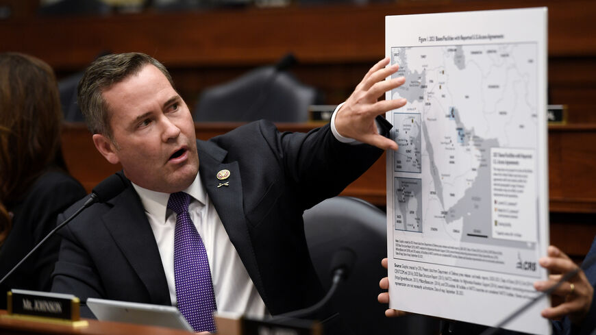 Rep. Michael Waltz (R-FL) displays a map with the 2021 bases/facilities with reported U.S. access agreements during a House Armed Services Committee hearing on the conclusion of military operations in Afghanistan at the Rayburn House Office building on Capitol Hill on September 29, 2021 in Washington, DC. The committee held the hearing “to receive testimony on the conclusion of military operations in Afghanistan and plans for future counterterrorism operations.” (Photo by Olivier Douliery-Pool/Getty Images)