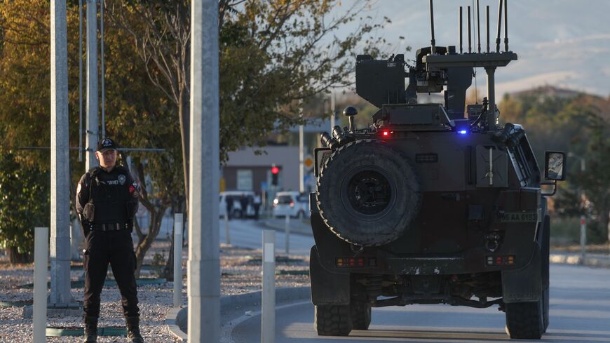 A Turkish Jandarma armored vehicle drives toward the entrance to the Turkish Aerospace Industries facility following an attack on Oct. 23, 2024 in Ankara, Turkey. 