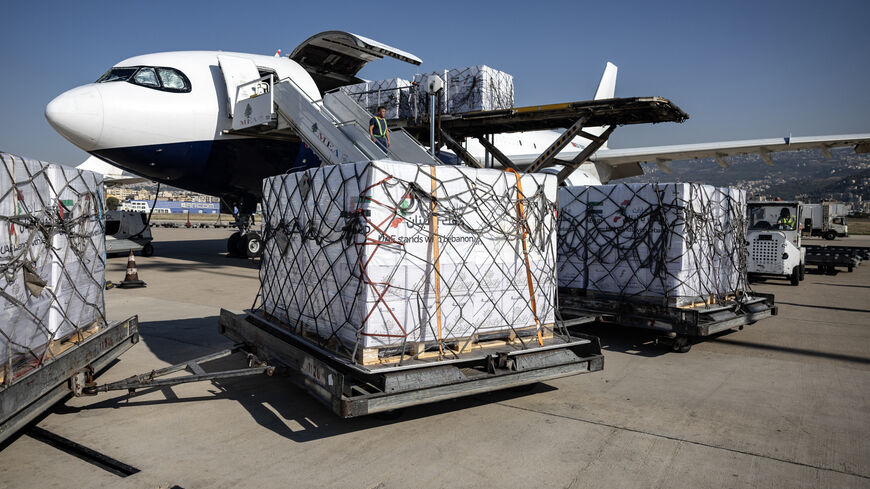 An airport worker unloads humanitarian aid, provided by the UAE, at Lebanon's Beirut international airport on October 28, 2024. (Photo by FADEL SENNA / AFP) (Photo by FADEL SENNA/AFP via Getty Images)