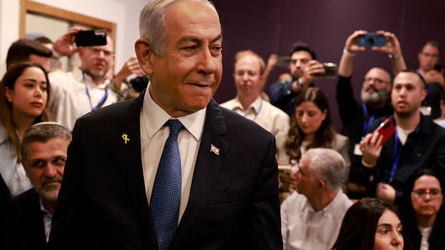 TOPSHOT - Israeli Prime Minister Benjamin Netanyahu arrives at the district court in Tel Aviv for his hearing on corruption charges on December 10, 2024. Netanyahu, the first sitting prime minister of Israel to face a criminal trial, testified for the first time when his corruption case resumed on December 10 on charges of bribery, fraud and breach of public trust in three separate cases. (Photo by Menahem KAHANA / POOL / AFP) (Photo by MENAHEM KAHANA/POOL/AFP via Getty Images)