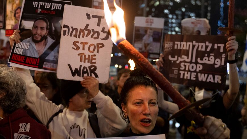 Protesters calling for the return of hostages held in the Gaza Strip react after a Gaza ceasefire and hostage release deal was reached on January 15, 2025 in Tel Aviv, Israel.