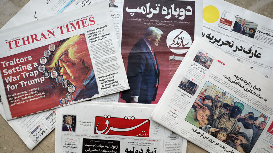 A picture shows copies of Iranian daily newspapers, including 'Sazandegi' (C) showing on its front page a picture of US President Donald Trump and a headline in Farsi reading 'Again Trump' at a newsstand in Tehran on Jan. 21, 2025.