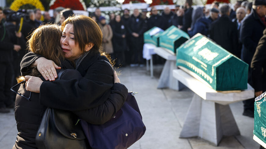 Mourners react during a funeral service for Sozcu newspaper columnist and journalist Nedim Turkmen, his wife and his two children killed during a huge fire in a ski resort hotel in Bolu, at Marmara University Faculty of Theology Mosque in Istanbul on Jan. 22, 2025. 