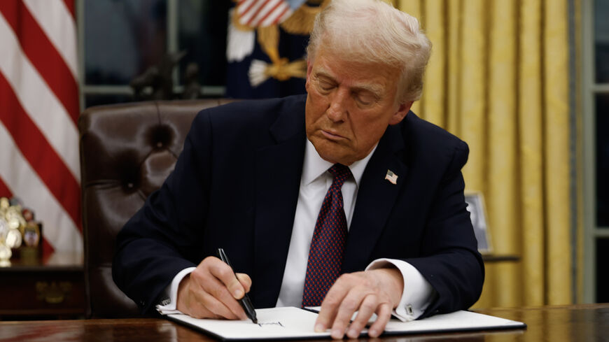 WASHINGTON, DC - JANUARY 20: President Donald Trump signs executive orders in the Oval Office of the White House on January 20, 2025 in Washington, DC. Trump takes office for his second term as the 47th president of the United States. (Photo by Anna Moneymaker/Getty Images)