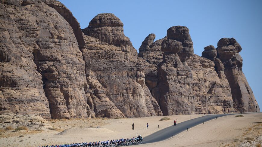 Riders compete during the first stage of the AlUla Tour cycling race from al-Manshiyah Train station to the al-Manshiyah Train Station, a 142.7 kilometers ride, in Alula, northwestern Saudi Arabia on January 28, 2025. (Photo by Loic VENANCE / AFP) (Photo by LOIC VENANCE/AFP via Getty Images)