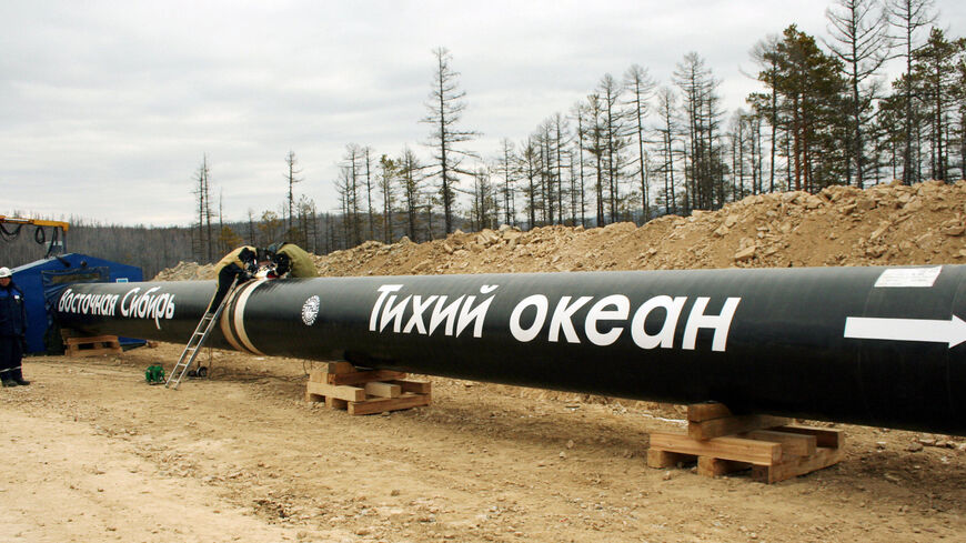 Workers weld a first juncture of the oil pipeline eastern Siberia on Oct. 13, 2006. 